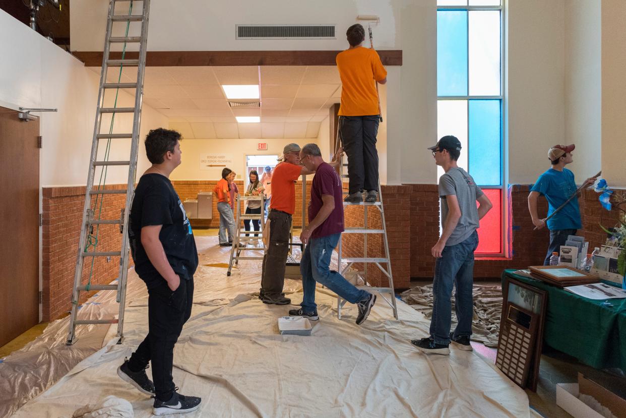 World Changers volunteers paint the entryway to Calvary Missionary Baptist Church in Henderson, Ky., Friday morning, June 17, 2022.