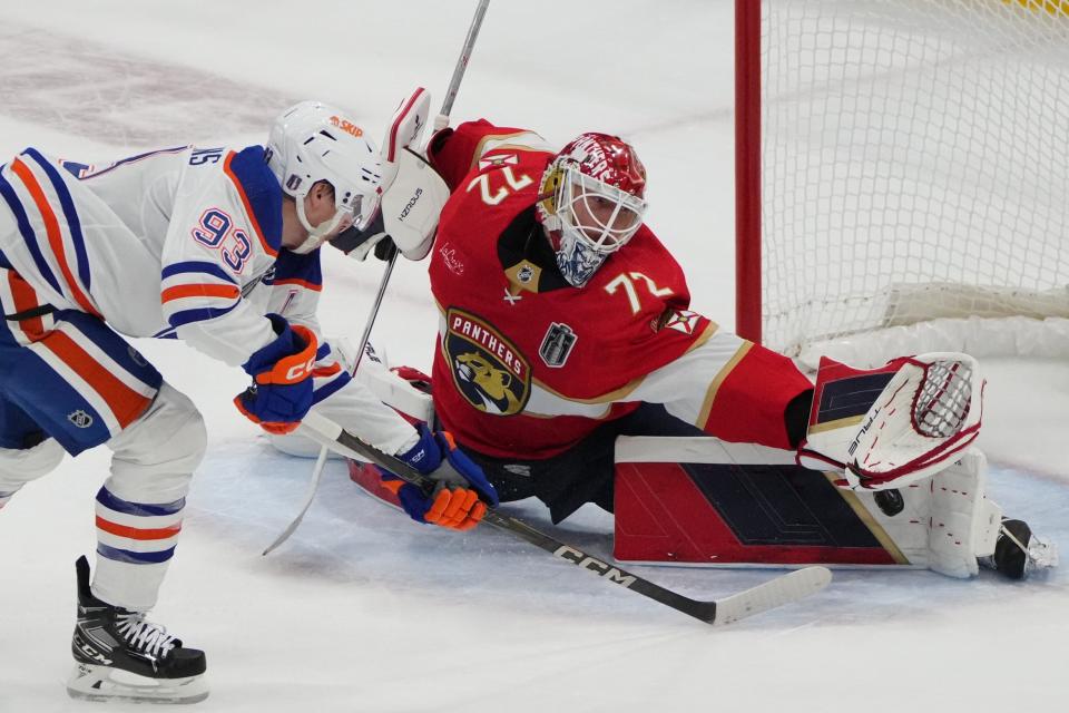 Jun 8, 2024; Sunrise, Florida, USA; Edmonton Oilers forward Ryan Nugent-Hopkins (93) shoots the puck against Florida Panthers goaltender Sergei Bobrovsky (72) during the first period in game one of the 2024 Stanley Cup Final at Amerant Bank Arena. Mandatory Credit: Jim Rassol-USA TODAY Sports