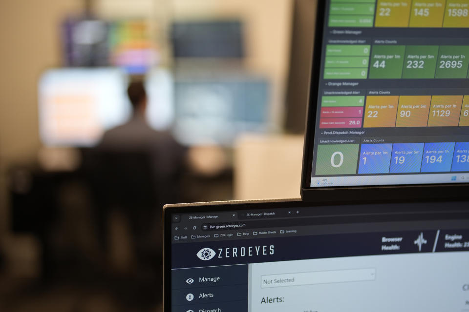 A ZeroEyes analyst monitors alerts at the company's operations center, Friday, May 10, 2024, in Conshohocken, Pa. (AP Photo/Matt Slocum)