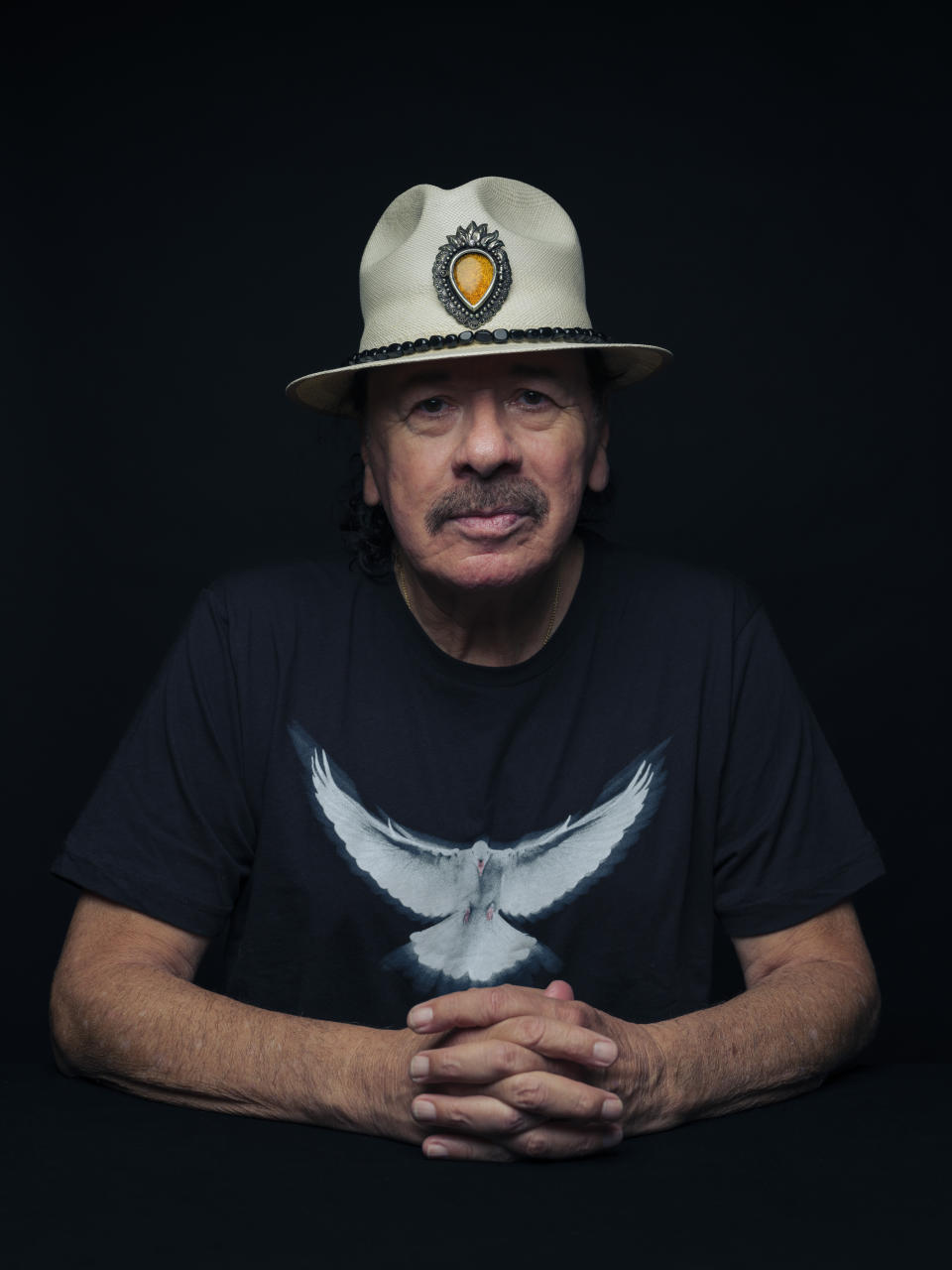 Carlos Santana poses for a portrait on Friday, June 16, 2023, in New York. (Photo by Drew Gurian/Invision/AP)