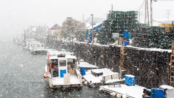 Snowy Portland, Maine harbor with lobster boats during a blizzard.