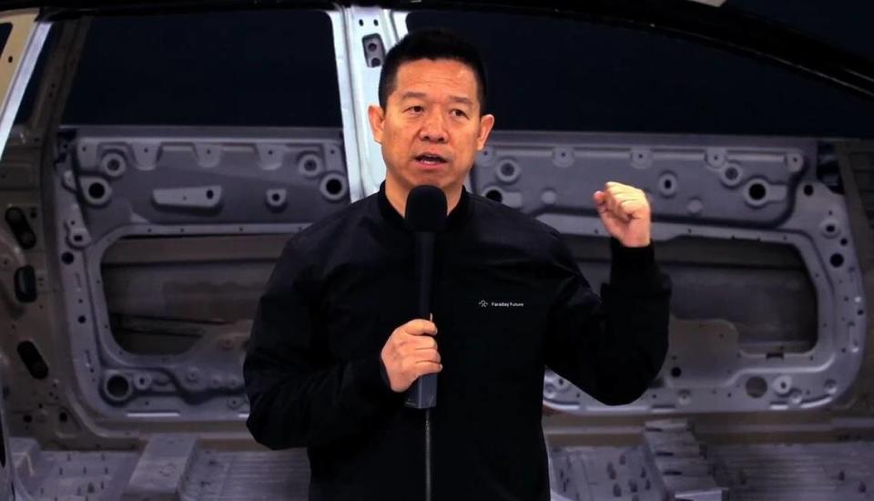 Faraday Future founder and former CEO Yueting “YT” Jia stands in front of the company’s first production unit of its FF 91 Futurist crossover SUV at the company’s factory in Hanford, CA, on March 29, 2023.