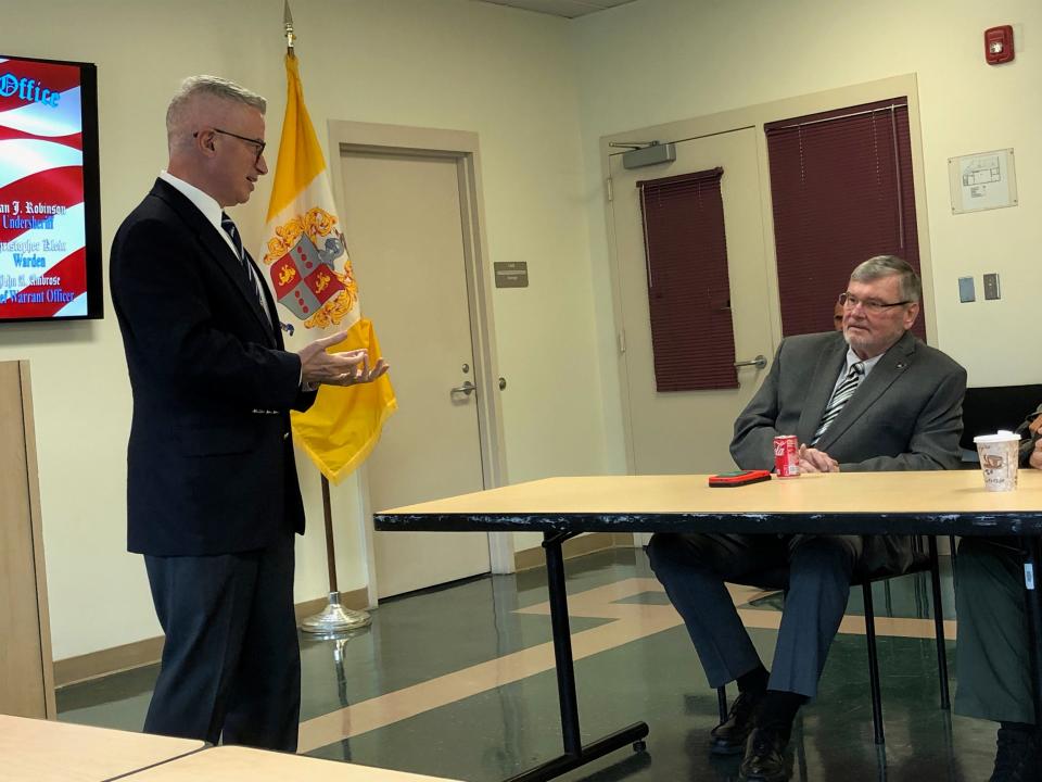 Jim McGreevey, left, chairman and executive director of the New Jersey Reentry Corporation and former New Jersey governor, speaks to Morris County Prosecutor Robert Carroll at the county correctional facility in Morristown Monday, Sept. 18, 2023.