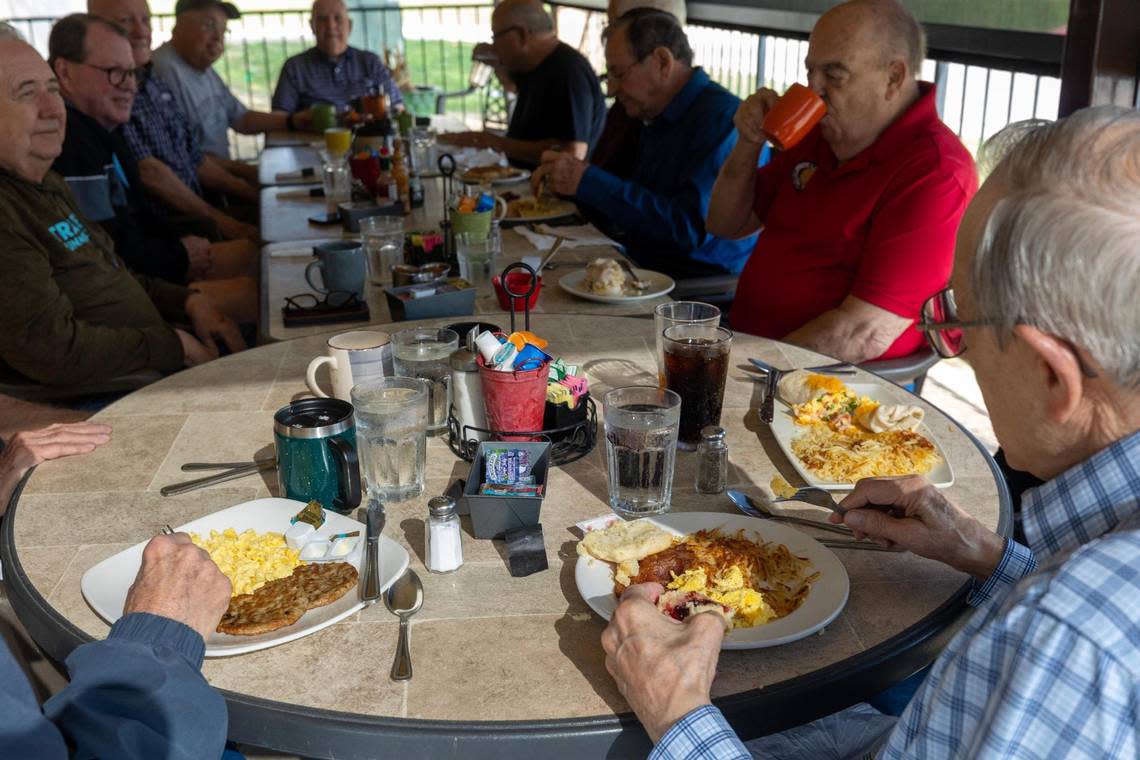 Diners eat breakfast at Bacon’s Bistro and Cafe in Hurst on Tuesday. The restaurant’s parking spaces have been split in half as a coffee chain is built in the lot.