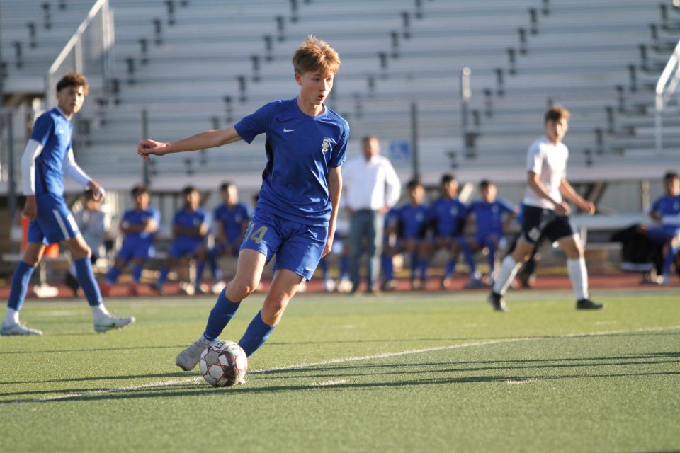 San Elizario High School's Noah Mendez moves down the field on Friday  at Del Valle High School in the Class 4A regional quarterfinal playoff game against Riverside. San Elizario won, 2-0, to advance to the Region 1-4A semifinals.
