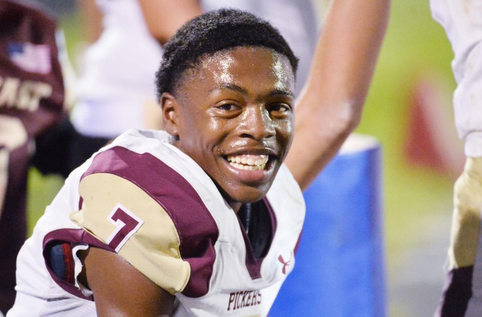 North East senior Jamari Curlett smiles with teammates after scoring a second-half touchdown against Girard in Girard on Sept. 1. Curlett was selected to the Pennsylvania Football Writers’ Class 3A All-State Team as an offensive athlete.