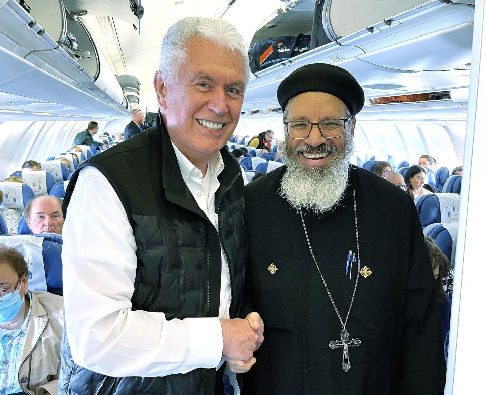 Elder Dieter F. Uchtdorf, of The Church of Jesus Christ of Latter-day Saints’ Quorum of the Twelve Apostles, pauses his conversation with a Coptic priest for a photo while boarding an airplane in Cairo, Egypt, on Monday, April 17, 2023. | Jeffrey D. Allred, Deseret News