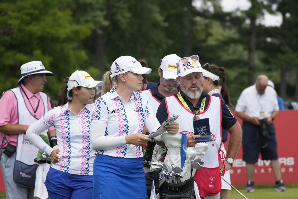 Matilda Castren of Finland, center, and Kelly Tan wait to tee off on the 13th tee during the final round of the Dow Great Lakes Bay Invitational golf tournament at Midland Country Club, Saturday, July 22, 2023, in Midland, Mich. (AP Photo/Carlos Osorio)