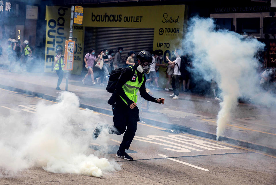 Image: Police fire tear gas on protesters demonstrating against new security legislation in Hong Kong on May 24, 2020. (Isaac Lawrence / AFP - Getty Images)