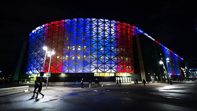 Friends Arena in Stockholm lit up in red, white and blue before the Euro 2016 football playoff between Sweden and Denmark.