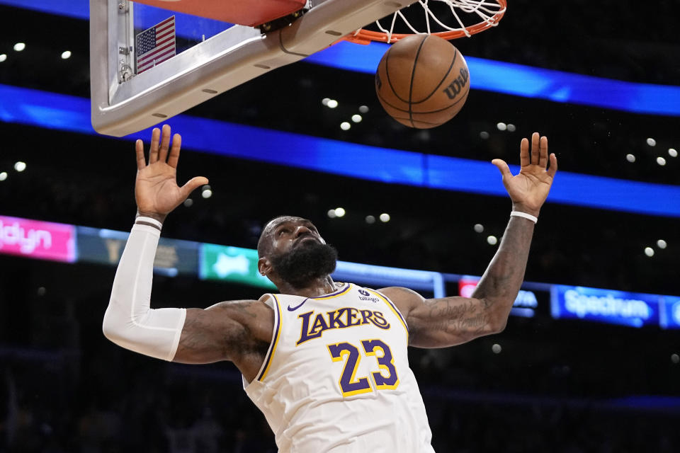 Los Angeles Lakers forward LeBron James completes a dunk during the second half in Game 4 of an NBA basketball first-round playoff series against the Denver Nuggets Saturday, April 27, 2024, in Los Angeles. (AP Photo/Mark J. Terrill)