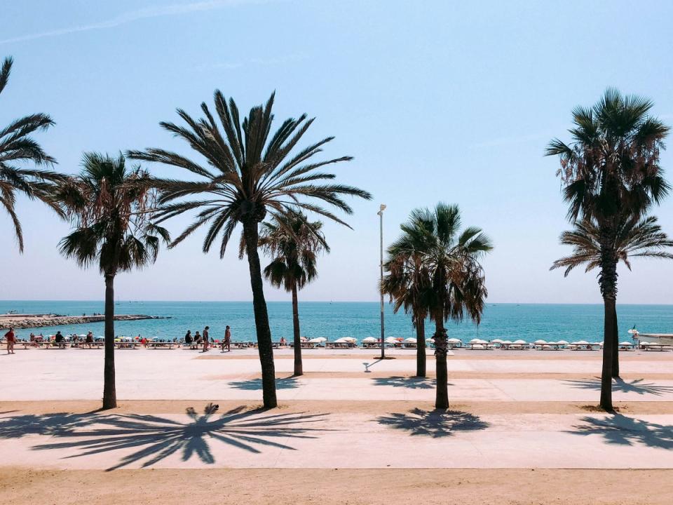 Take the train all the way to beachy Barcelona (Lucrezia Carnelos / Unsplash)