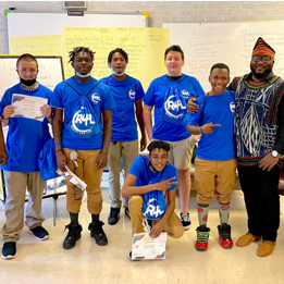 An instructor poses with students of the South Carolina Center for Fathers and Families. South Carolina Center for Fathers and Families is a national fatherhood initiative model that supports families, builds communities and prevents child poverty.