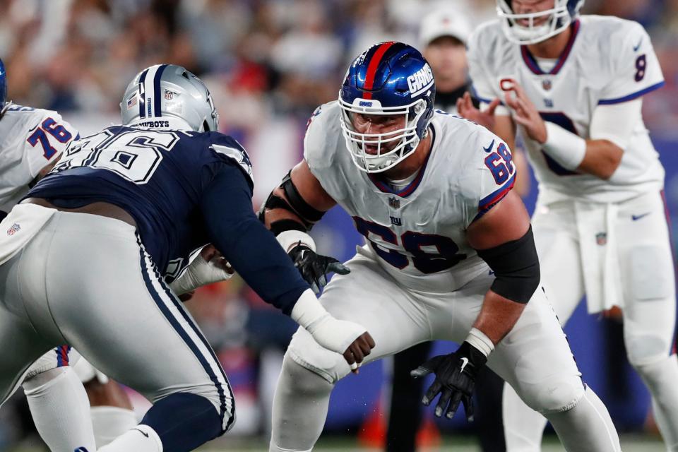 New York Giants guard Ben Bredeson (68) moves in to block Dallas Cowboys defensive tackle Neville Gallimore (96) during an NFL football game, Monday, Sept. 26, 2022, in East Rutherford, N.J.