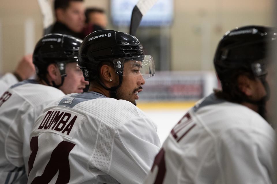 Arizona Coyote defenseman Matt Dumba (24) watches from the players box on Sept. 28, 2023, at Ice Den Scottsdale.