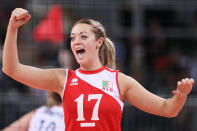 LONDON, ENGLAND - JULY 30: Lydia Oulmou of Algeria celebrates winning the third set in the Women's Volleyball Preliminary match between Great Britain and Algeria on Day 3 of the London 2012 Olympic Games at Earls Court on July 30, 2012 in London, England. (Photo by Elsa/Getty Images)