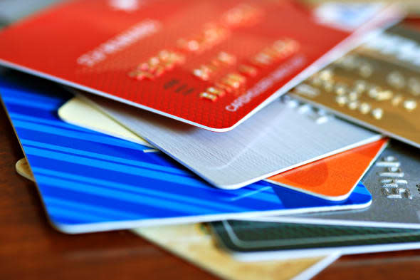 Colorful stack of credit cards and shopping gift cards.  Macro with extremely shallow dof.