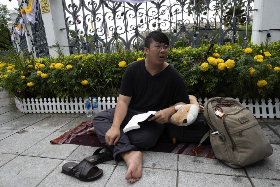 Activist Pumiwat Rangkasiwit begins a hunger strike outside Government House in Bangkok, Thailand, Monday, July 20, 2020. Pumiwat is part of a group of social activists demanding the government to make an inclusive economic and welfare system, issue more measures to help the unemployed who are unable to access the government's welfare system and reconsider the current government policies with popular participation. They demand the government step down if it cannot accomplish these goals. (AP Photo/Sakchai Lalit)