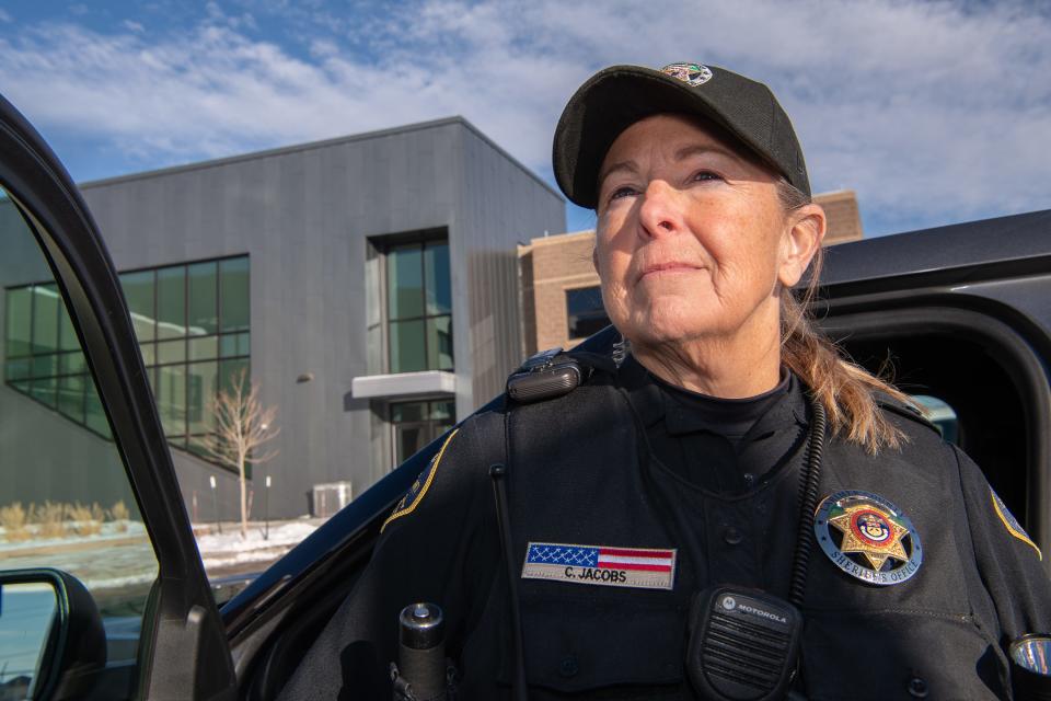Cheryl Jacobs, a mental health first responder with the Larimer County Sheriff's Office, stands for a portrait at the Larimer County Sheriff's Office in Fort Collins in January.