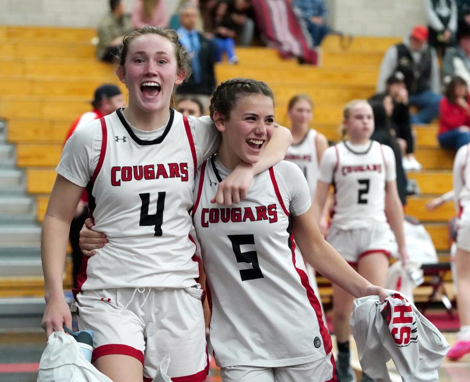 Foothill’s Lexi Peters, left, and Kundal Whitehouse celebrates as they walk back to the locker room after defeating Alisal on Thursday night in Palo Cedro.