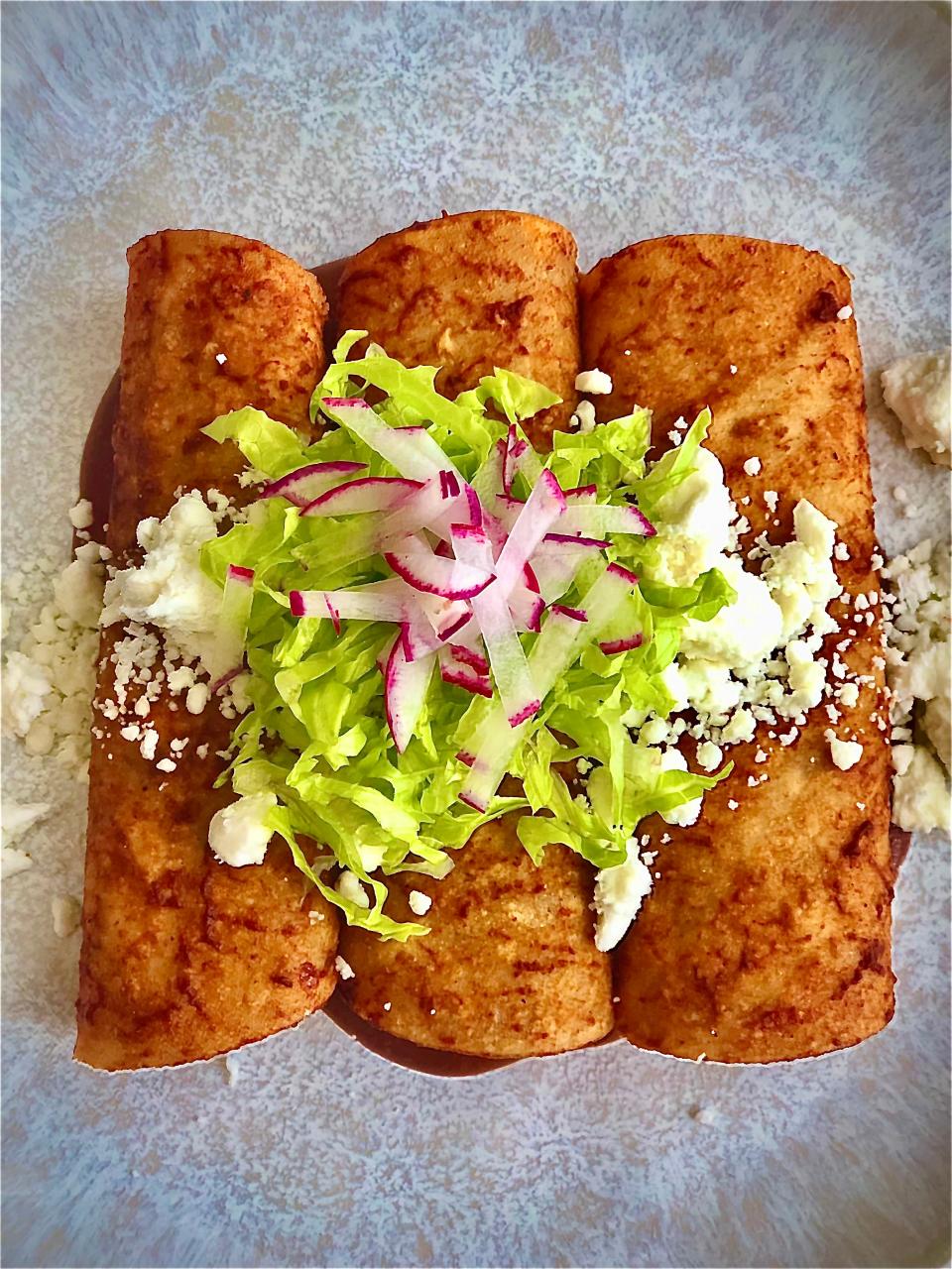Veggie Enchiladas with Corn, Zucchini, Chile Sauce, Red Beans and Feta from the Carlos Miguel restaurant pop-up from Memphis chef Charles Willoughby.