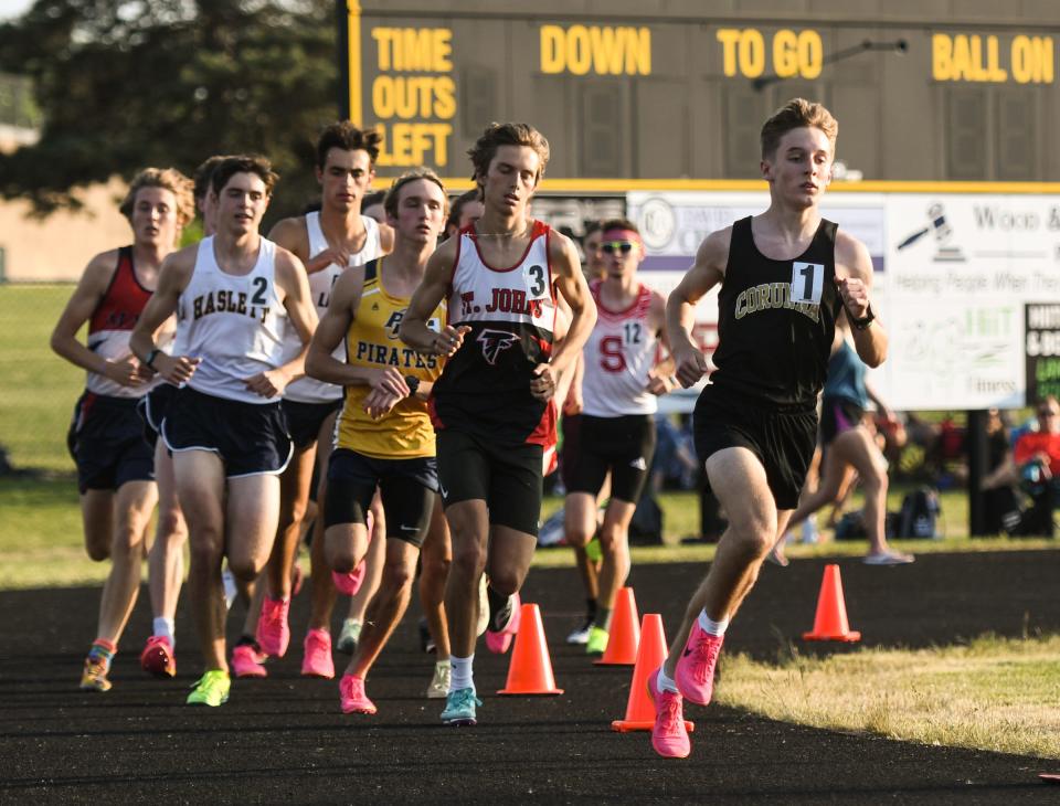 Kenny Evans of Corunna leads the first lap of the 1600 meter run but would finish runner-up to Nate Carmody of Haslett, Tuesday, May 30, 2023, at the Greater Lansing Honor Roll Meet at Waverly.