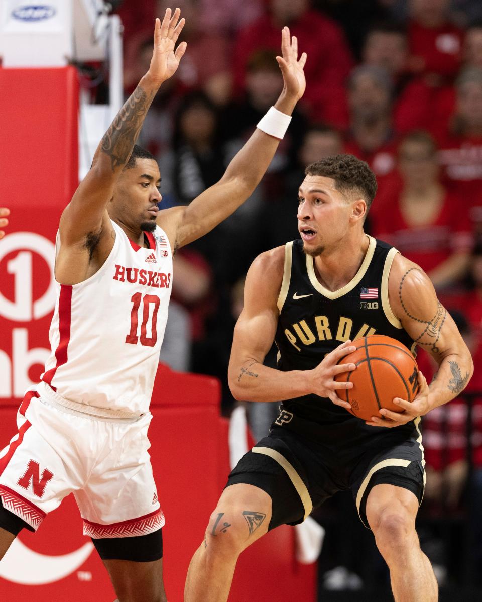 Nebraska's Jamarques Lawrence, left, guards Purdue's Mason Gillis during the first half of an NCAA college basketball game Tuesday, Jan. 9, 2024, in Lincoln, Neb. (AP Photo/Rebecca S. Gratz)