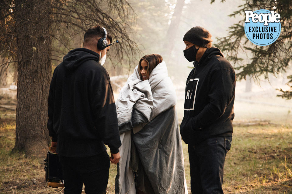 <p>Wife Katelyn bundles up on the set of the music video in Jackson Hole, Wyoming, where wildfires burned earlier this month.</p>