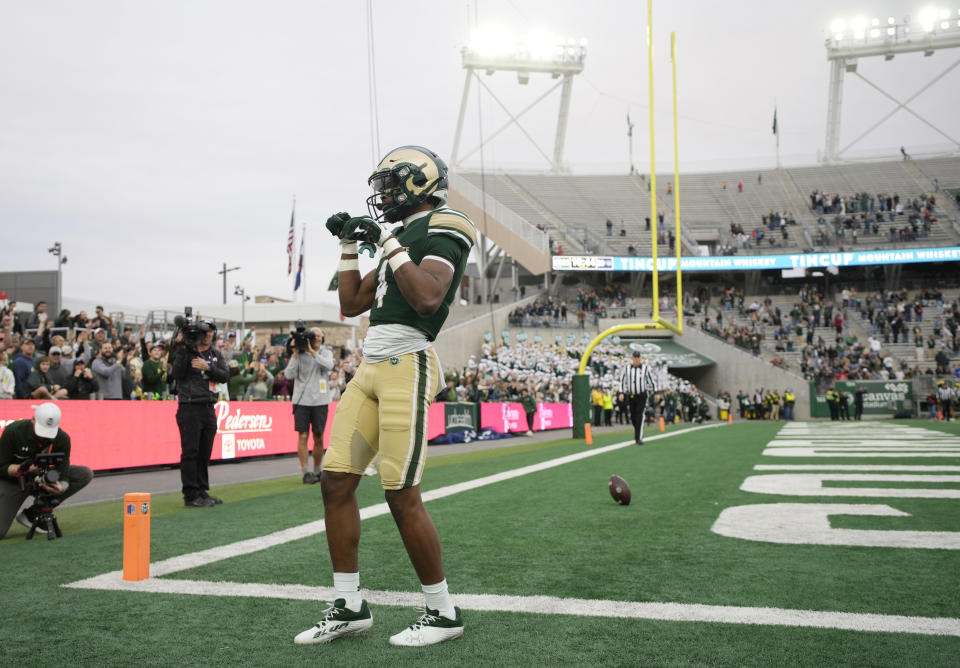 Colorado State wide receiver Louis Brown IV (4) celebrates after catching a touchdown pass against Nevada in the second half of an NCAA college football game Saturday, Nov. 18, 2023, in Fort Collins, Colo. (AP Photo/David Zalubowski)