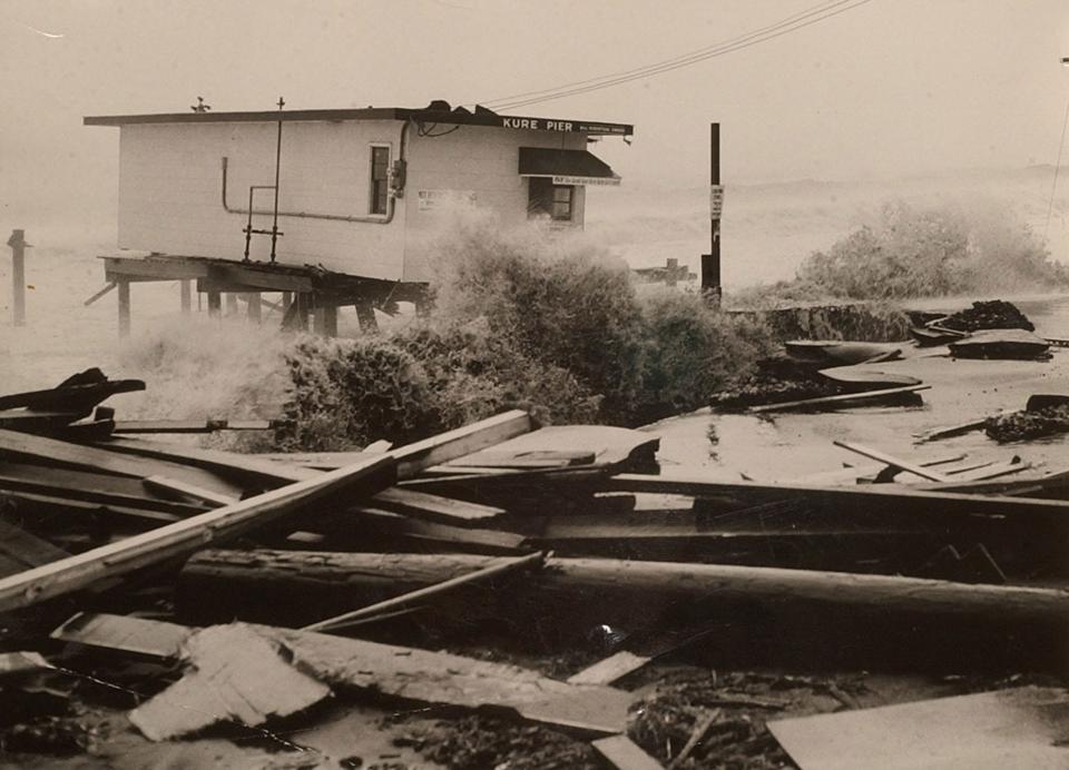 The storm-whipped surf smashes into the Kure Beach Fishing Pier during Hurricane Hazel in 1954.