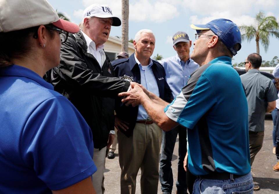<p>President Donald Trump (2ndL) is accompanied by Vice President Mike Pence (C) and Florida Governor Rick Scott (2ndR) while meeting with people impacted by Hurricane Irma in Naples, Fla., Sept.14, 2017. (Photo: Jonathan Ernst/Reuters) </p>