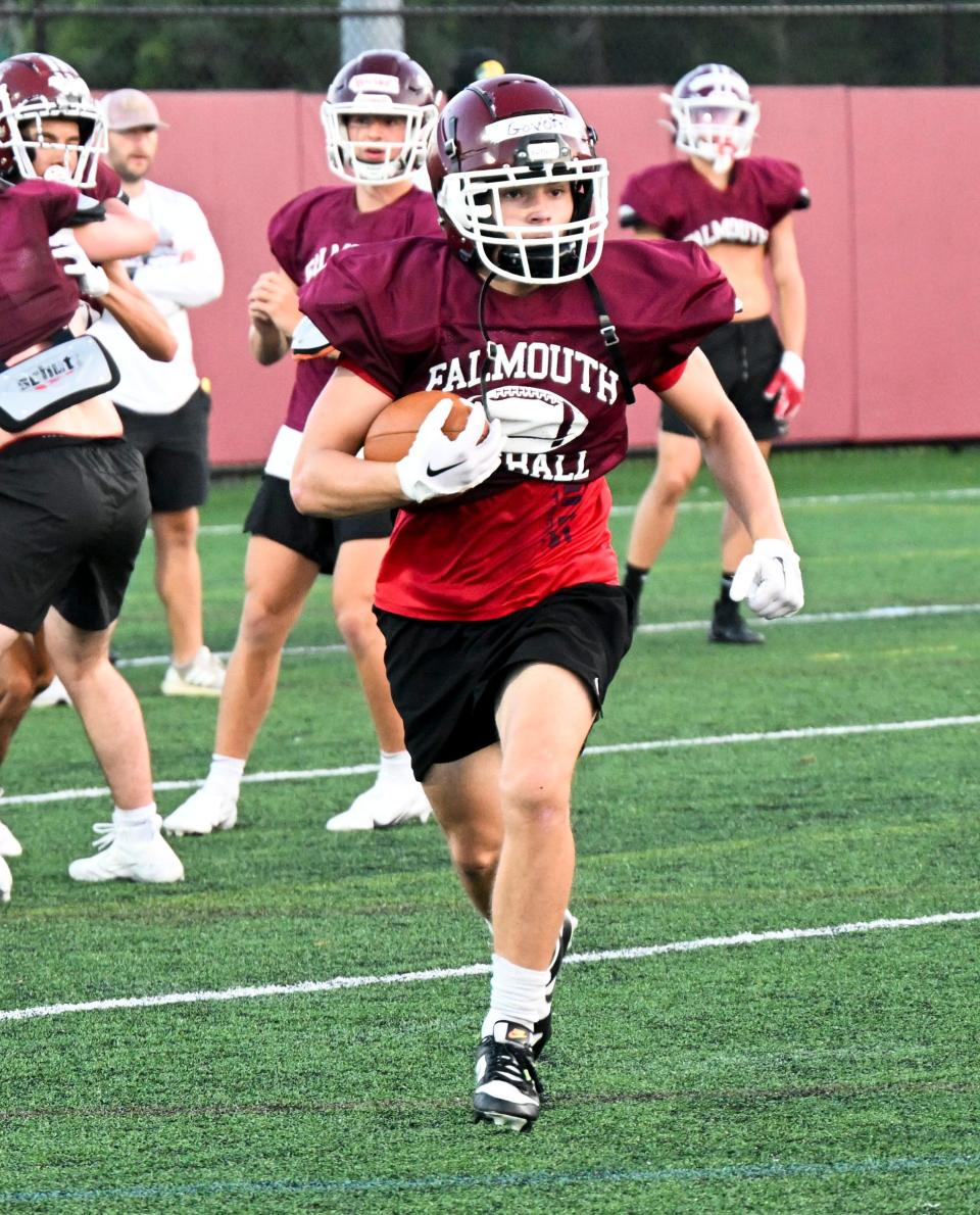 Falmouth running back Collin Govoni runs with the ball during a recent football practice.