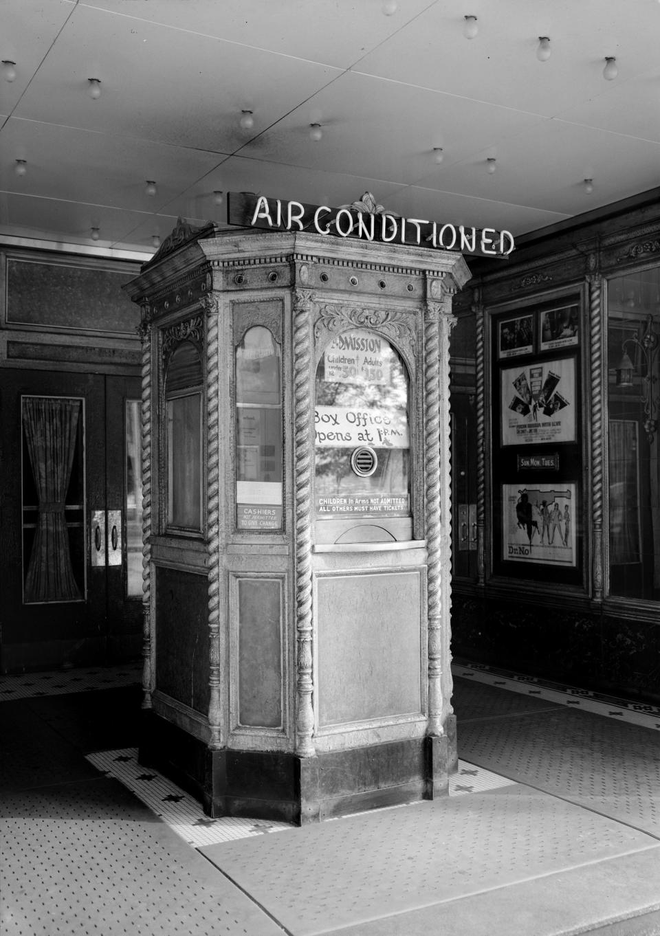 A theater's lobby advertises air conditioning to prospective movie-goers.<span class="copyright">LMPC/Getty Images</span>