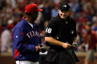 ARLINGTON, TX - OCTOBER 23: Manager Ron Washington talks with home plate umpire Ron Kulpa during Game Four of the MLB World Series against the St. Louis Cardinals at Rangers Ballpark in Arlington on October 23, 2011 in Arlington, Texas. (Photo by Tom Pennington/Getty Images)