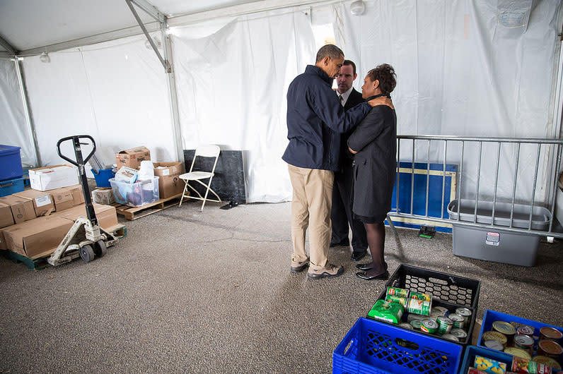 <b>Nov. 15, 2012:</b> "The President tries to comfort Damien and Glenda Moore at a FEMA Disaster Recovery Center tent in Staten Island, N.Y. The Moore’s two small children, Brandon and Connor, died after being swept away during Hurricane Sandy." (Official White House Photo by Pete Souza)