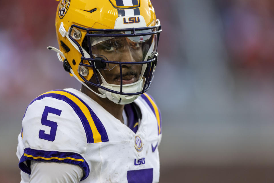 LSU quarterback Jayden Daniels checks the sideline during the first half of an NCAA football game against Mississippi on Saturday, Sept. 30, 2023, in Oxford, Miss. (AP Photo/Vasha Hunt)
