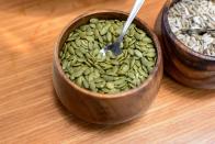 <p>“These tasty green seeds should be part of your healthy routine year-round,” says Largeman-Roth. “A ¼ cup of shelled pumpkin seeds contains 180 calories, 9 grams of filling plant protein, 3 grams of fiber, and 14 grams of satisfying fat. The fat in pumpkin seeds is primarily monounsaturated (MUFA) and polyunsaturated fats (PUFA). <a href="https://academic.oup.com/jn/article-abstract/148/11/1821/5105881?redirectedFrom=fulltext" rel="nofollow noopener" target="_blank" data-ylk="slk:Research;elm:context_link;itc:0;sec:content-canvas" class="link ">Research</a> has shown that replacing saturated and trans fat in the diet with unsaturated fat, especially PUFA, helps prevent weight gain as we age.” Here are <a href="https://www.prevention.com/food-nutrition/g20485218/roasted-pumpkin-seed-recipes/" rel="nofollow noopener" target="_blank" data-ylk="slk:five easy ways to roast pumpkin seeds;elm:context_link;itc:0;sec:content-canvas" class="link ">five easy ways to roast pumpkin seeds</a>.</p>