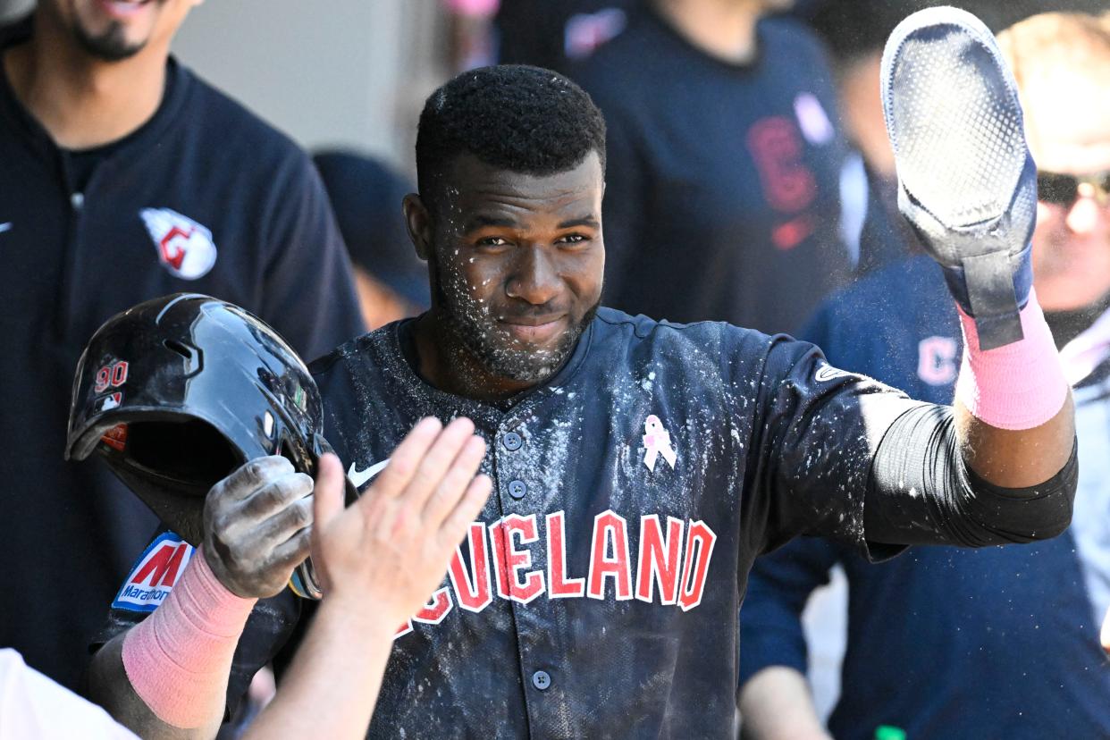 Guardians outfielder Estevan Florial celebrates in the dugout after scoring against the White Sox during the third inning, May 12, 2024, in Chicago.