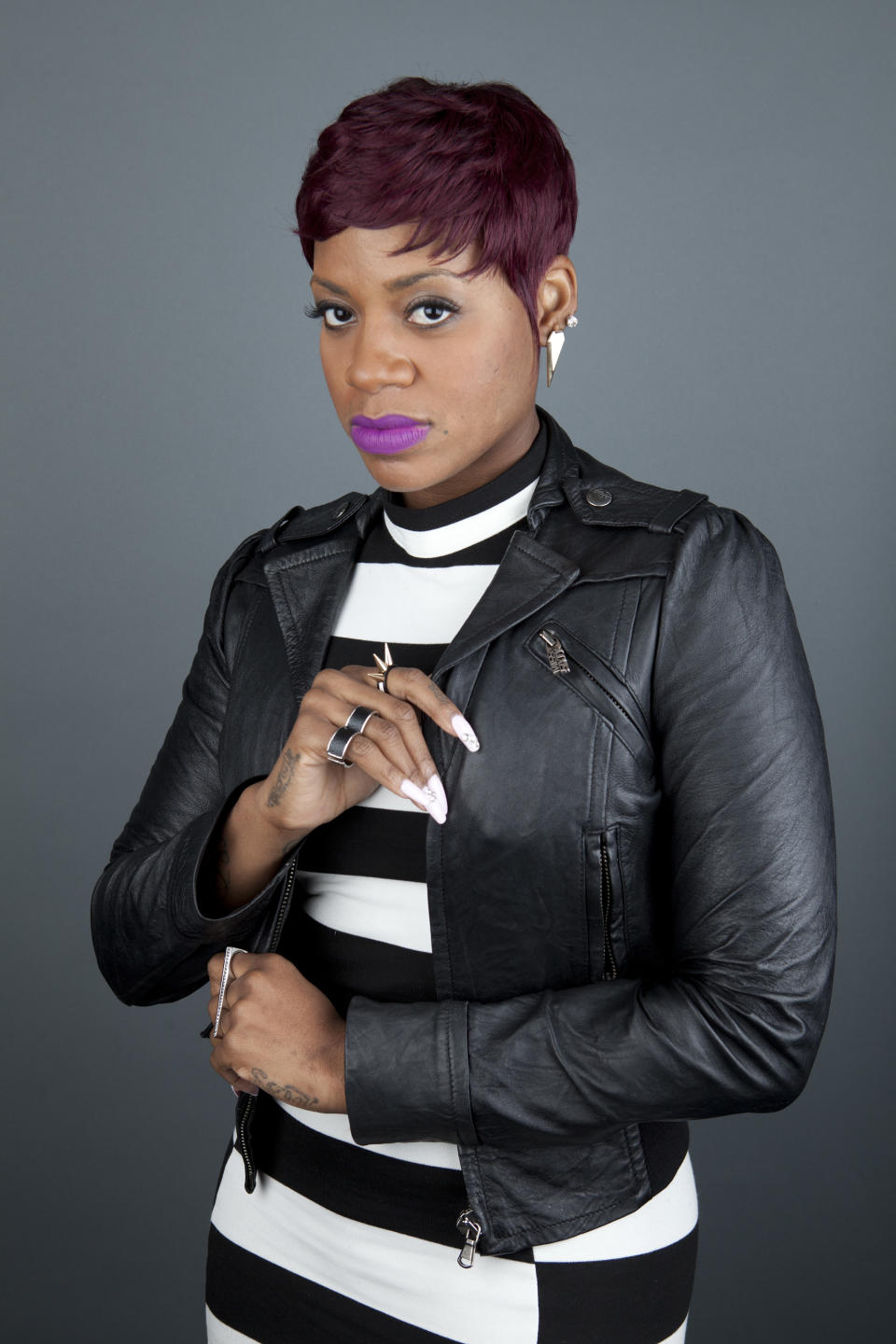 This April 24, 2013 photo shows American R&B singer Fantasia Barrino posing for a portrait to promote her new album "Side Effects of You," in New York. (Photo by Amy Sussman/Invision/AP)