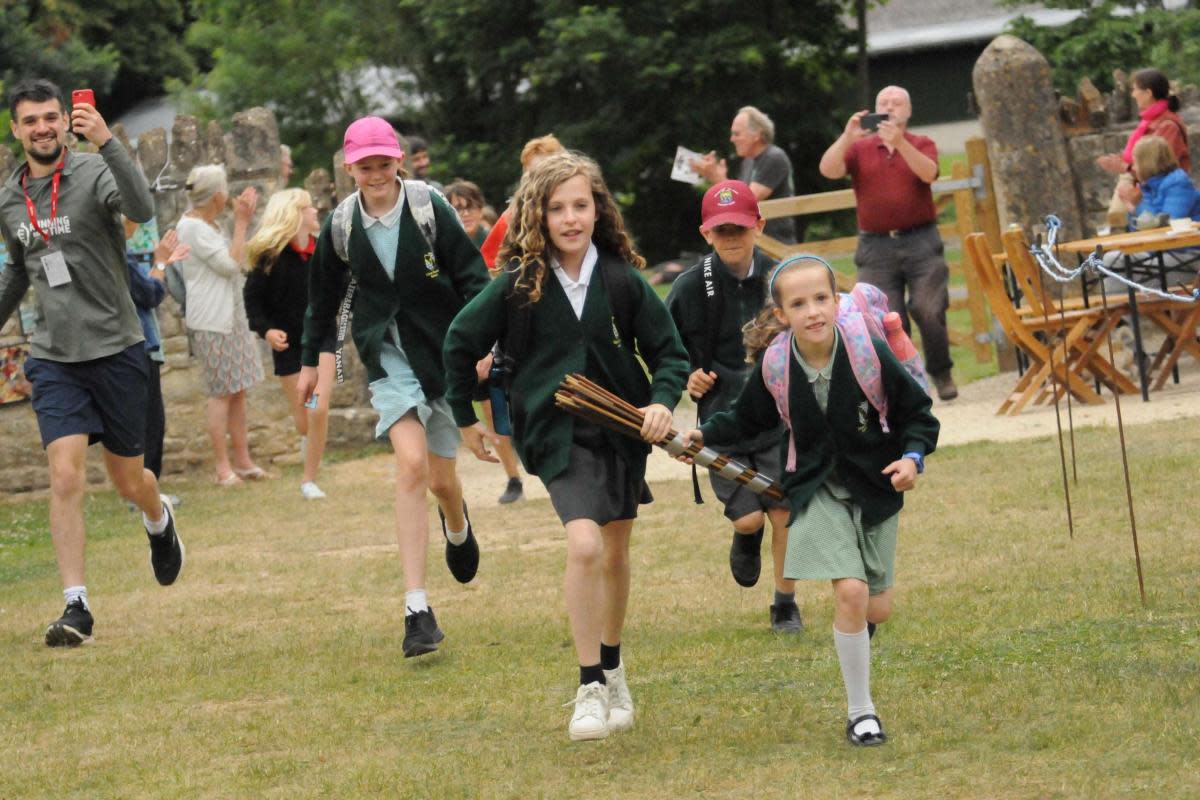 Christchurch Primary School pupils run in with the baton during the Running Out of Time relay in Bradford on Avon. <i>(Image: Trevor Porter)</i>