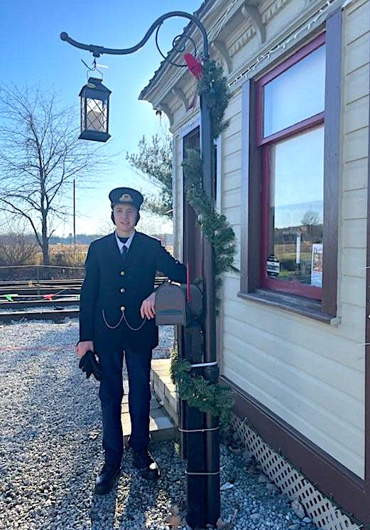 Ethan Williams, in costume as conductor at the Rittman Railroad Depot, will give a program about the station history and make a plea for support in preserving it during a program at the library on Tuesday.