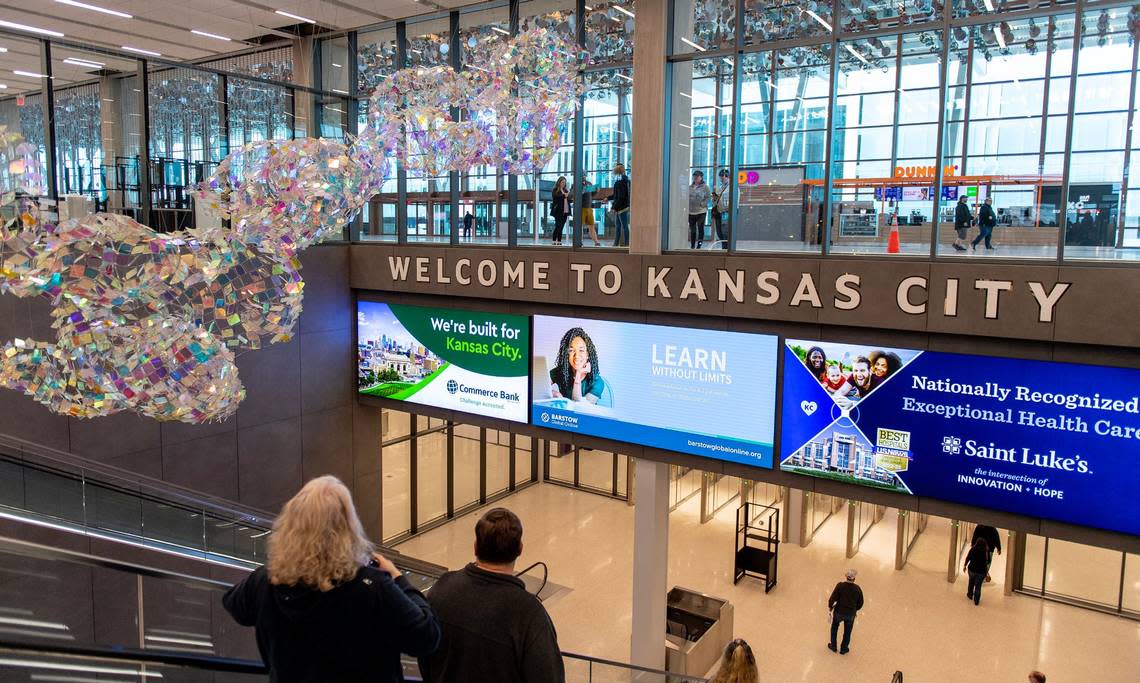 Artwork by Soo Sunny Park titled “Molten Swing” greets travelers as they descend an escalator to the baggage claim area at the new Kansas City International Airport terminal on Saturday, Feb. 18, 2023, in Kansas City.