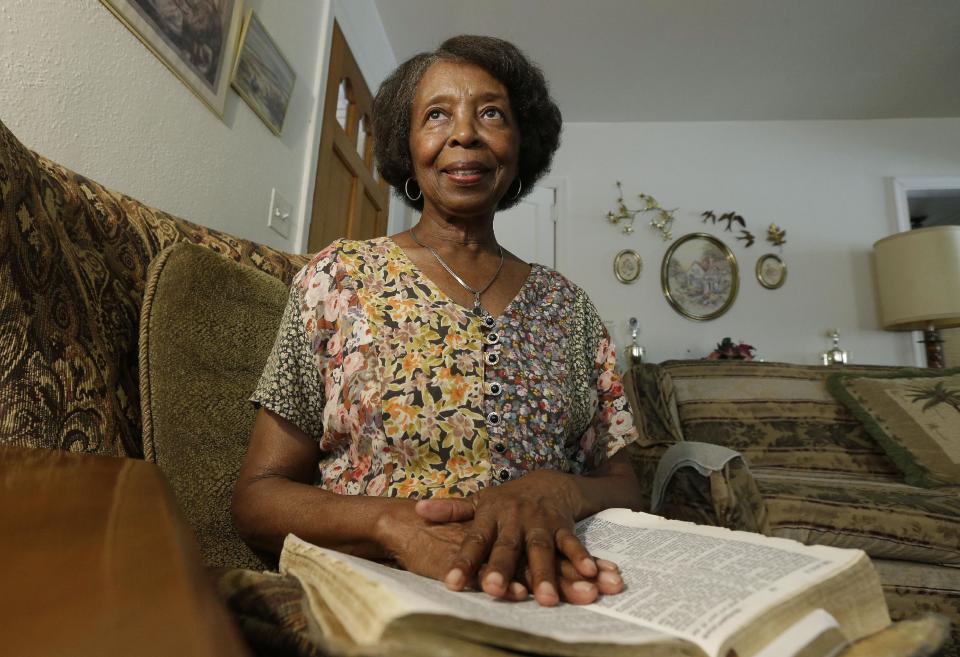 Henrietta Tripp holds her bible at her home in Birmingham, Ala., Friday, Sept. 6, 2013. Tripp was walking to a service at her church, Zion Hill Missionary Baptist, the Sunday when the 16th Street Baptist Church bombing occurred five decades ago. "Why so much so hatred?" she thought to herself. "Why so much anger?" (AP Photo/Dave Martin)