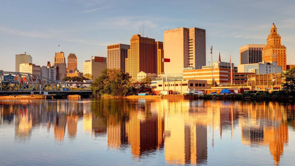 Downtown Newark skyline refection on the banks of the Passaic River.