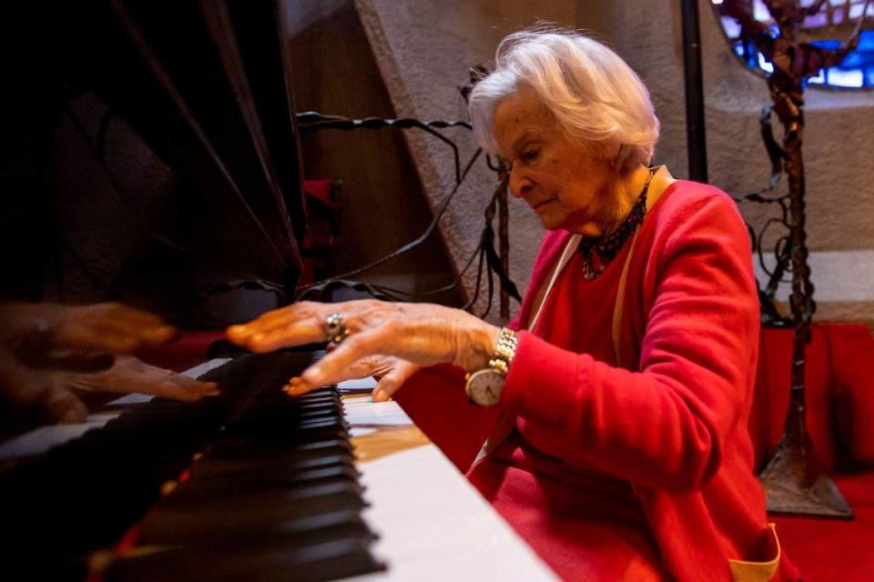 Long-time congregant of Temple Israel of Greater Miami Ruth Greenfield, 98, plays a piano inside the Chapel of Light, in Miami, Florida, on Friday, March 11, 2022.