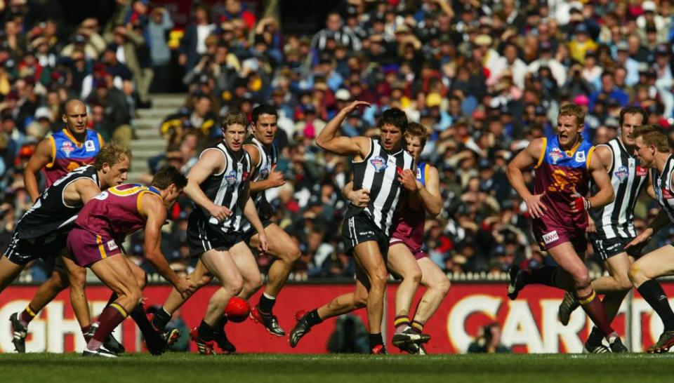 Brisbane’s Simon Black attempts to pick up the ball during the 2003 AFL grand final