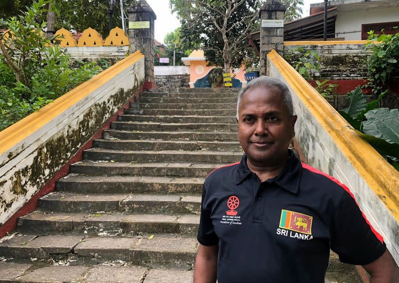 Kushil Gunasekera, founder of Foundation of Goodness charity that helps tsunami victims in Seenigama village, poses for a photograph at the high-ground temple that saved hundreds of lives during the 2004 tsunami, in Seenigama, Sri Lanka