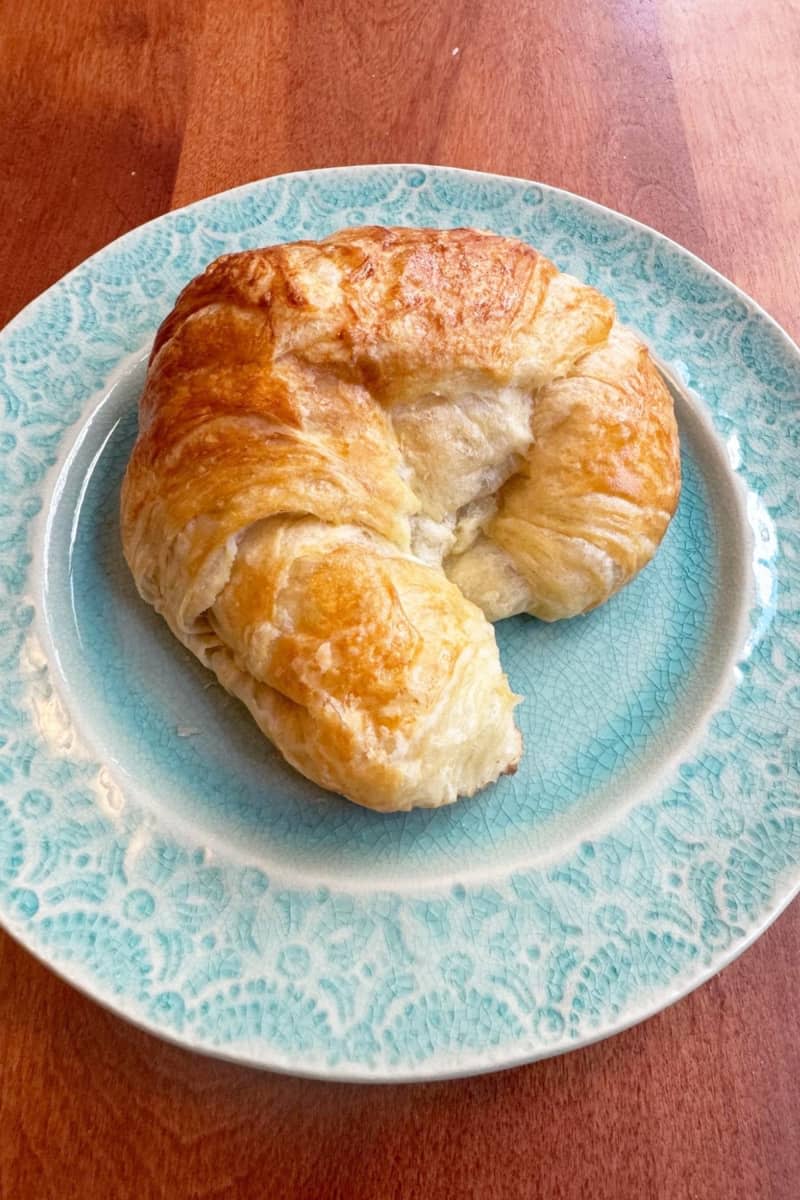 Croissant on a teal blue plates