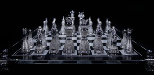 Super Slow Motion Chess Pieces Fall on the Chessboard. Filmed on a