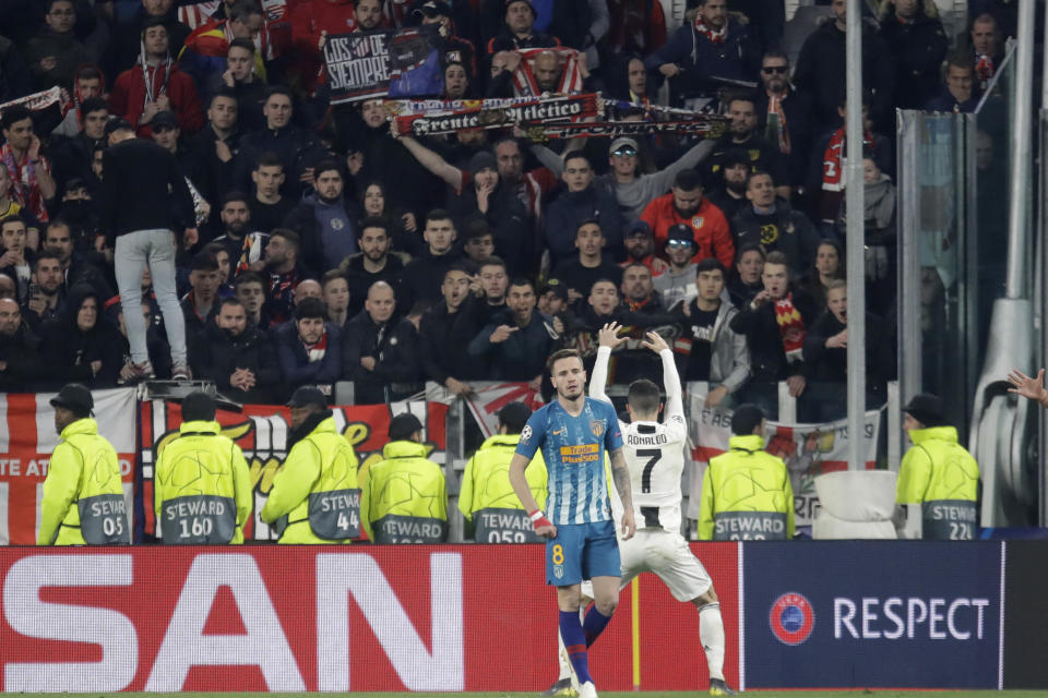 Juventus' Cristiano Ronaldo reacts in front of Atletico fans at the end of the Champions League round of 16, 2nd leg, soccer match between Juventus and Atletico Madrid at the Allianz stadium in Turin, Italy, Tuesday, March 12, 2019. (AP Photo/Luca Bruno)